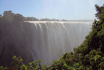 Credit: Egline Tauya a waterfall with trees in the background