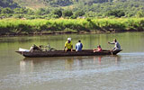 Credit: Munjoma a group of people in a small boat in a body of water