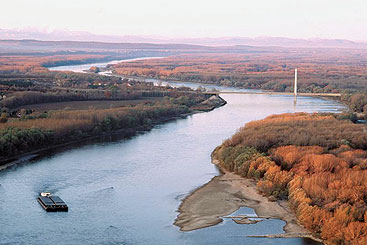 Credit: via-donau/Kovacs a large body of water with a mountain in the background