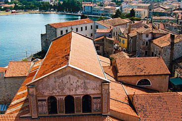 Credit: Jacques Croizer a large brick building with a mountain in the background