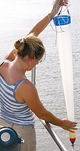 a person standing in front of water