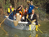 a group of people riding on the back of a boat