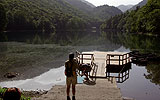 a person riding a horse in a body of water