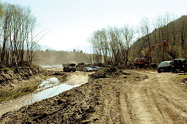 a car driving down a dirt road