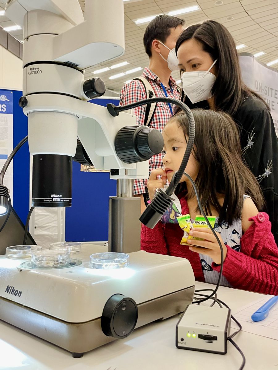 a child with a microscope