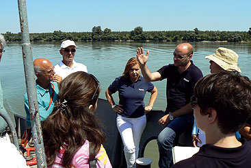 Credit: Photo by the Project Team a group of people standing next to a body of water