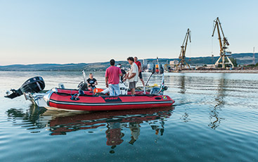 a group of people in a boat on a body of water