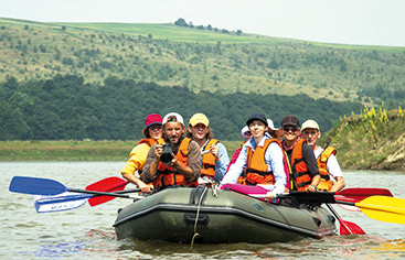 © Ecological Movement of Moldova a group of people riding on the back of a boat