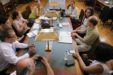 © Tögel/via donau a group of people sitting at a table