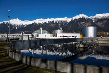 a bridge over a snow covered mountain