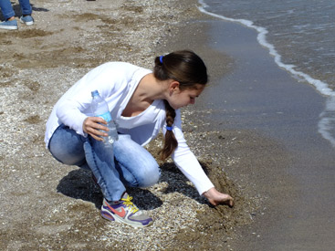 a small child playing in a body of water