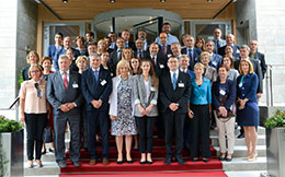 a group of people standing in front of a crowd posing for the camera