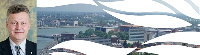 a large body of water with a city in the background