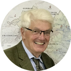 Wolfgang Stalzer a man wearing a suit and tie