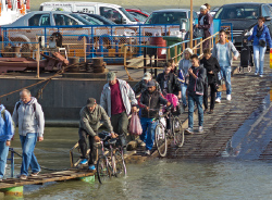 a group of people crossing a bridge