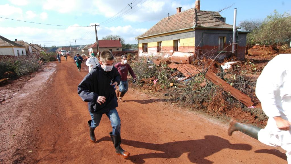 People running away from a village