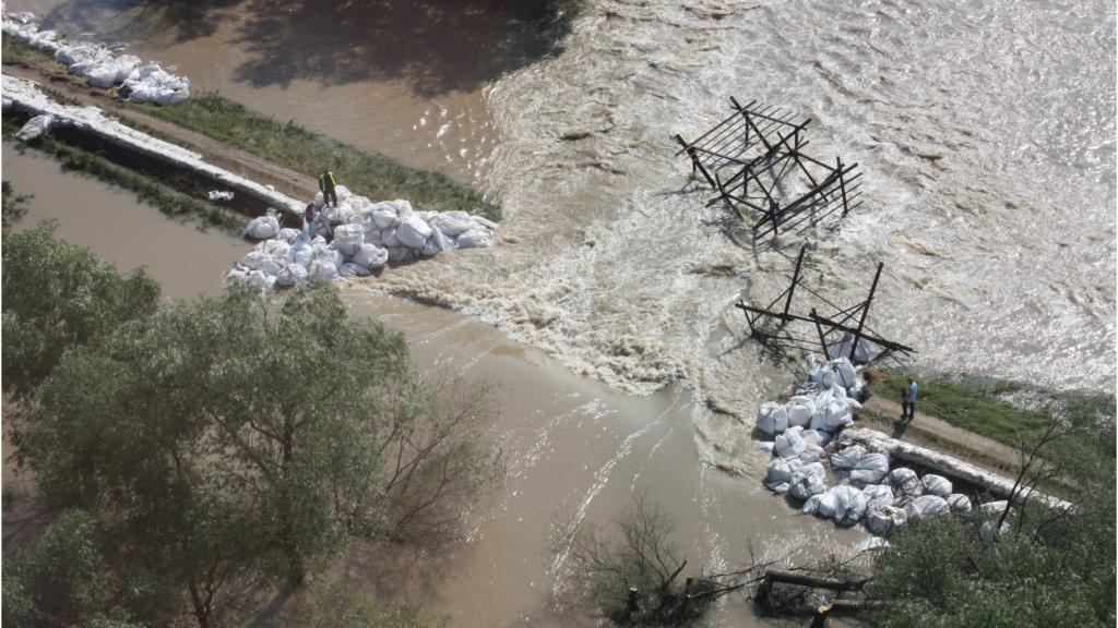 Dam broken by flooding water