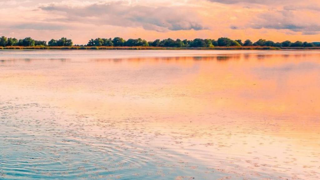 Sunset on the water in Romania