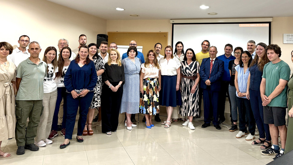 A group photo of people at a conference