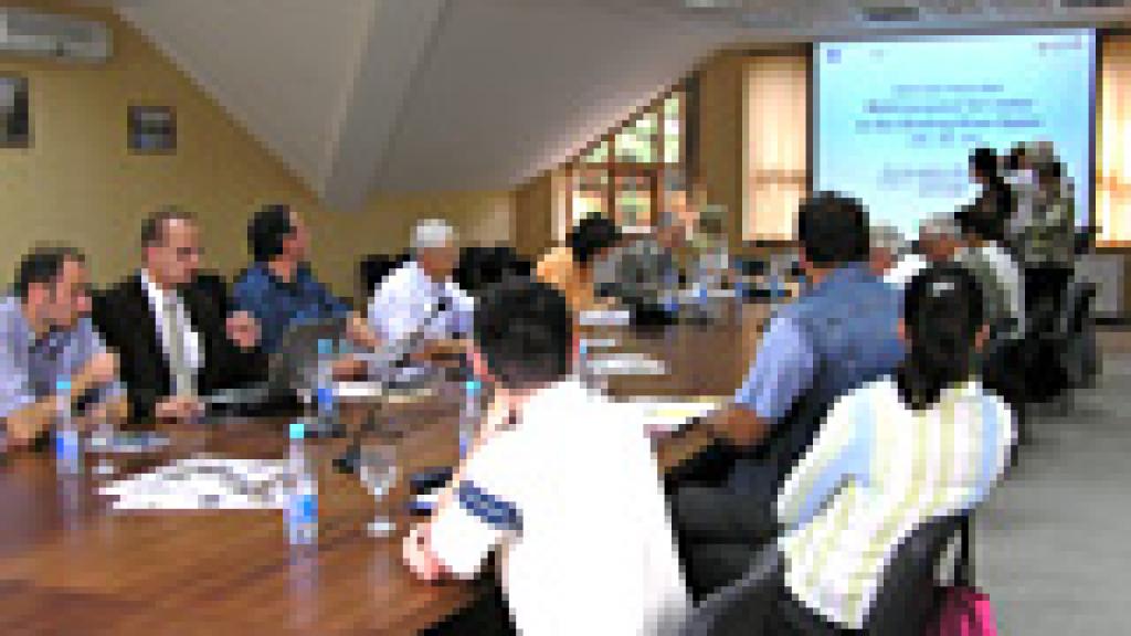 a group of people in a meeting room