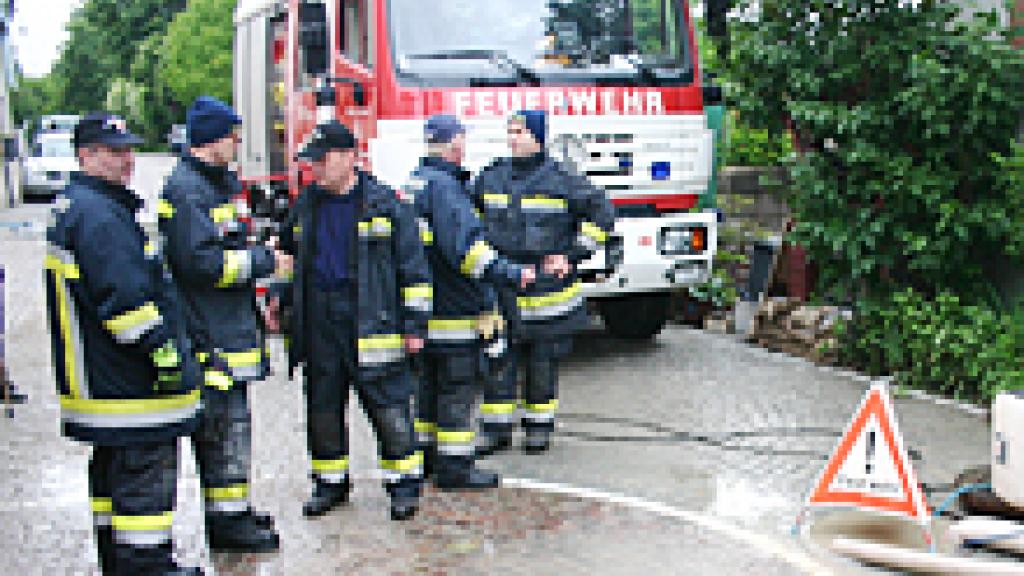 a group of firefighters with a truck