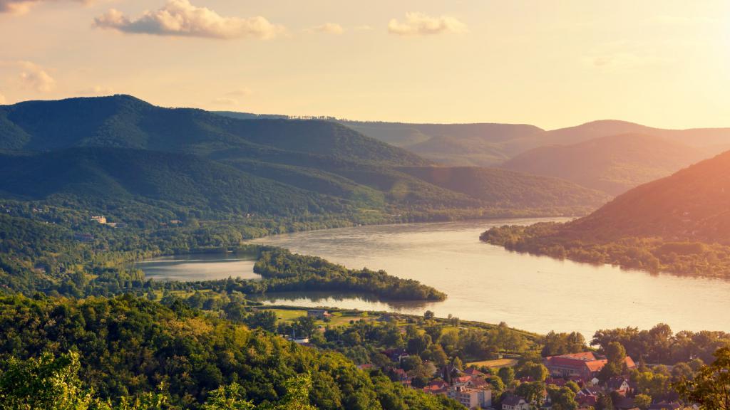 Aerial shot of the Danube river flowing through town 