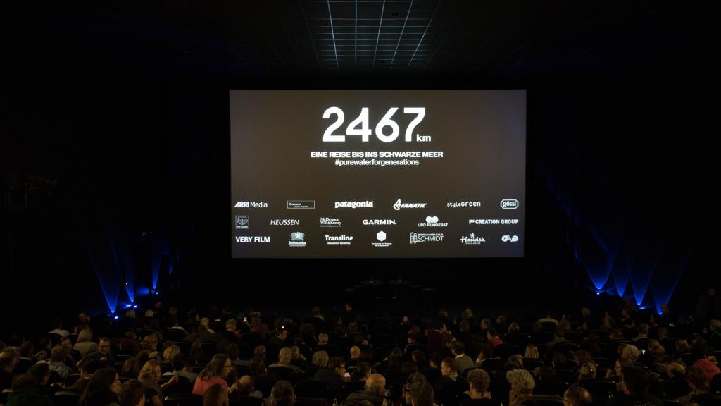 Crowd of people in front of a presentation stage