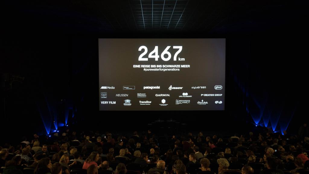 Crowd of people  in front of a presentation stage 