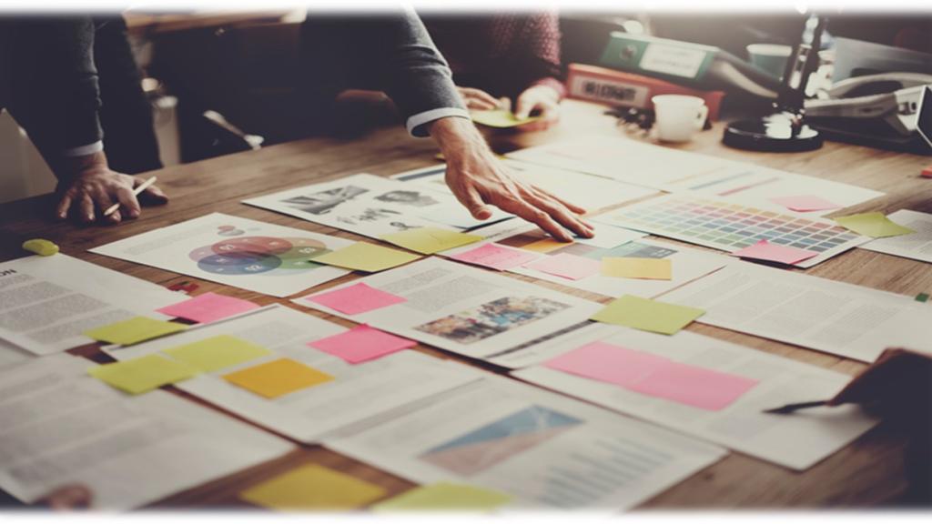 Documents spread out on table 