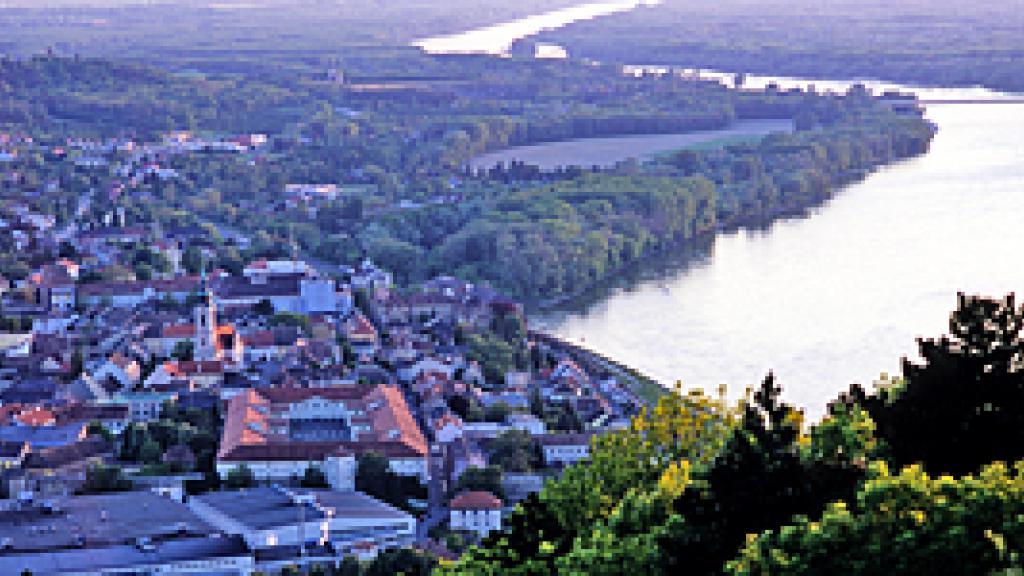 a large body of water with a city in the background