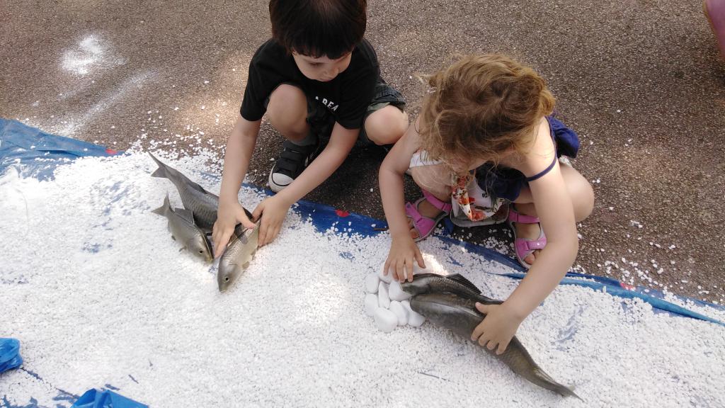 Two small children participating in Danube Day activity 