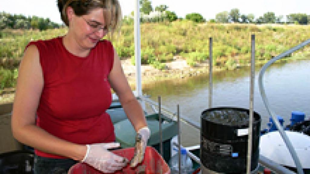 Woman taking river samples