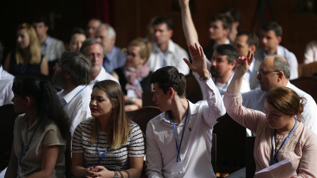 a group of people in front of a crowd