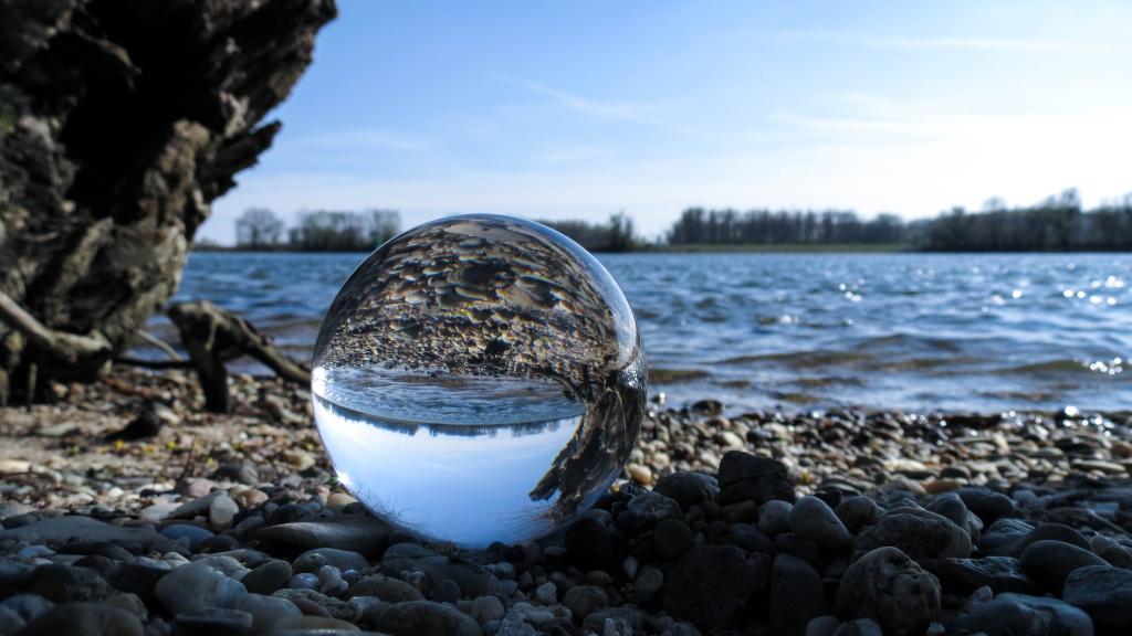 a rocky beach next to a body of water