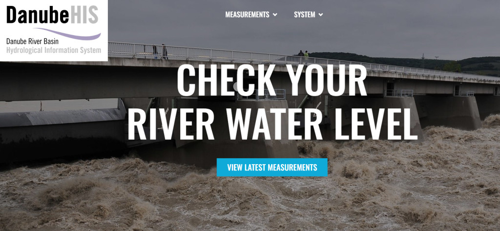 © Csaba Csont Image of a river at a hydropower plant. On the left handside a logo of the DanubeHIS portal, in the center a text that reads: check your water level. A blue box in the centrer below the text reads view latest measurements.