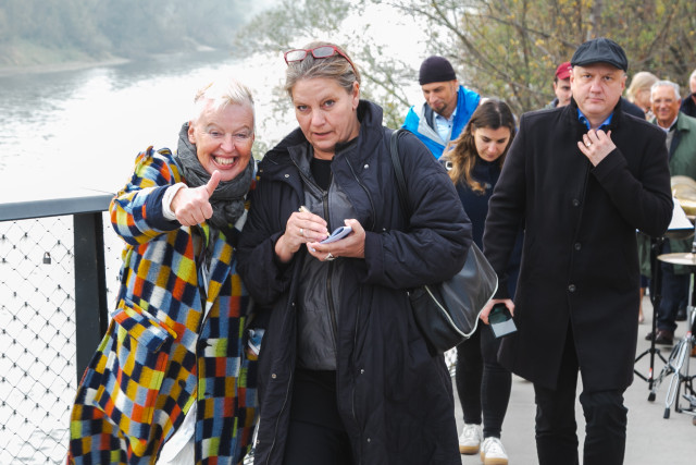 Two women standing and posing together