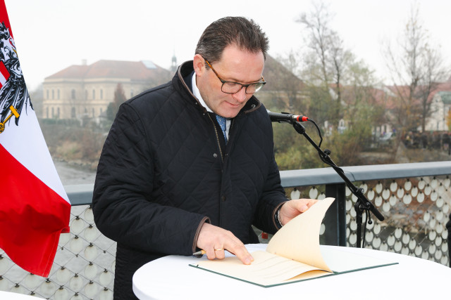 A man looking into a book 