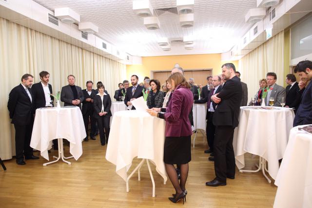 a group of people standing in a room