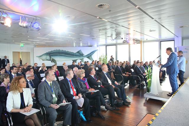 a group of people standing in front of a crowd posing for the camera