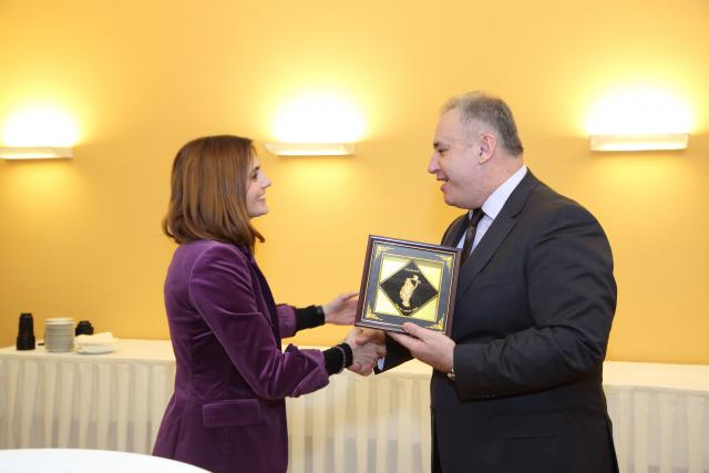 a man and a woman standing in a room