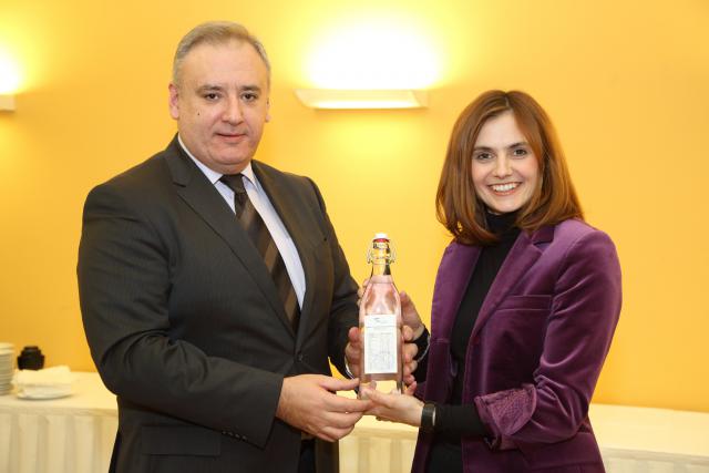 a man and a woman holding a wine glass