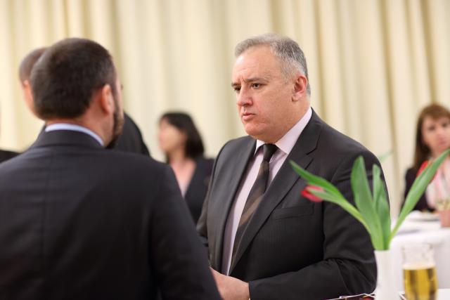 a man wearing a suit and tie