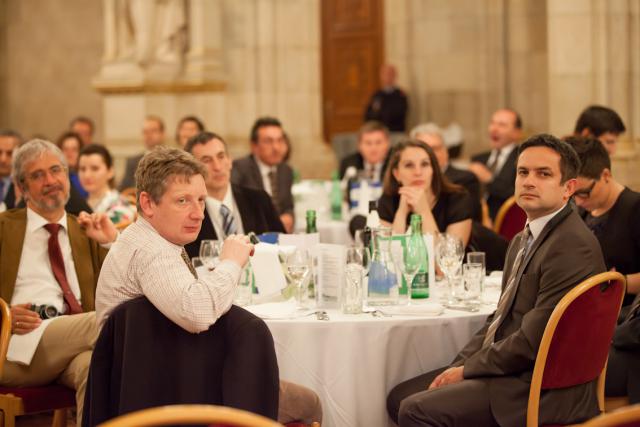 a group of people sitting at a table