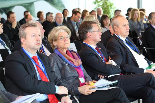 a group of people sitting in front of a crowd