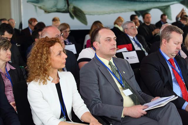 a group of people sitting in front of a crowd