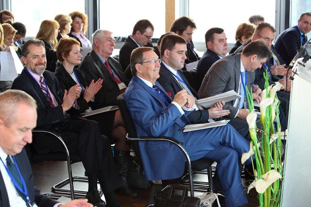 a group of people sitting at a desk