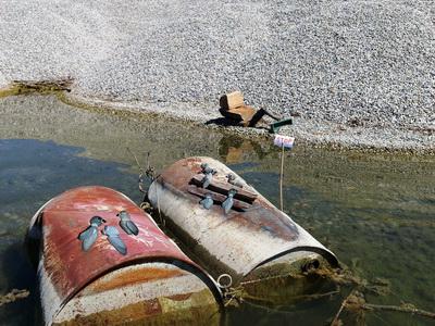 a boat sitting next to a body of water