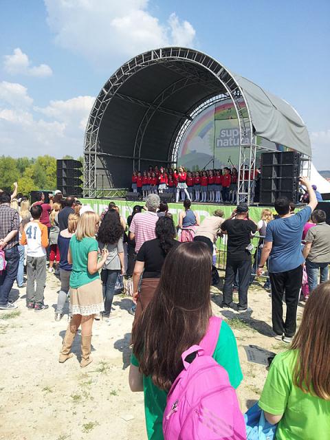 a group of people standing in front of a crowd