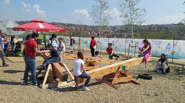 a group of people sitting at a picnic table