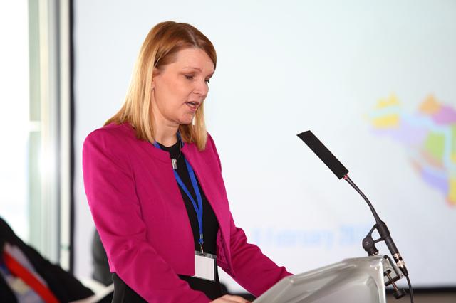 a woman wearing a suit and tie